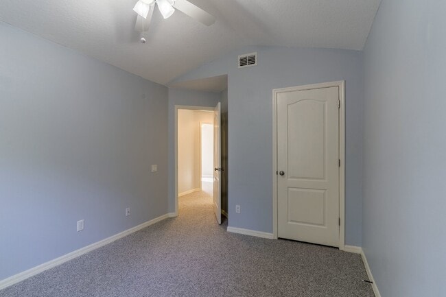 Building Photo - Beautiful 4/2 home Located on a tree lined street in the gate of country club community of the Hu...