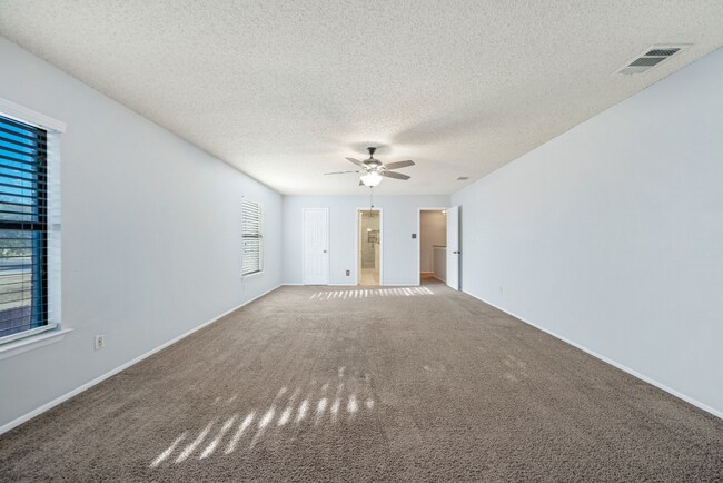 Building Photo - Sign your lease and receive a FREE 50" TV!!!  "Spacious 4-Bedroom Retreat with Fireplace in Charm...