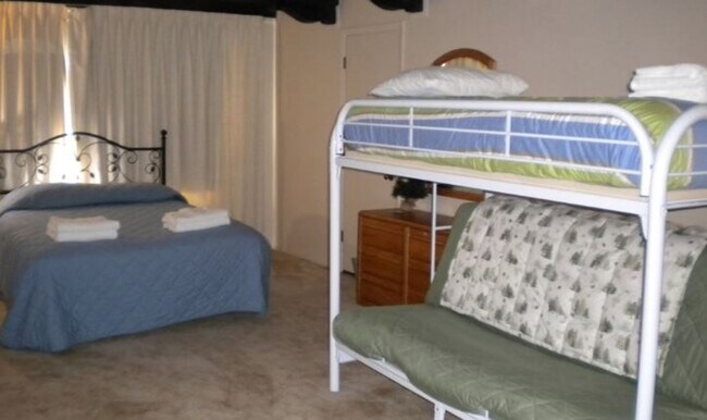 Building Photo - Unique open design,wood beams in all rooms-Very cheery and cozy. Newly remodeled, and newly furni...