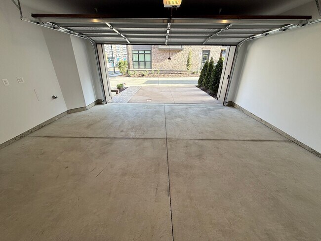 Building Photo - Brand new 4 level, 4 Bedroom Townhome with Elevator!