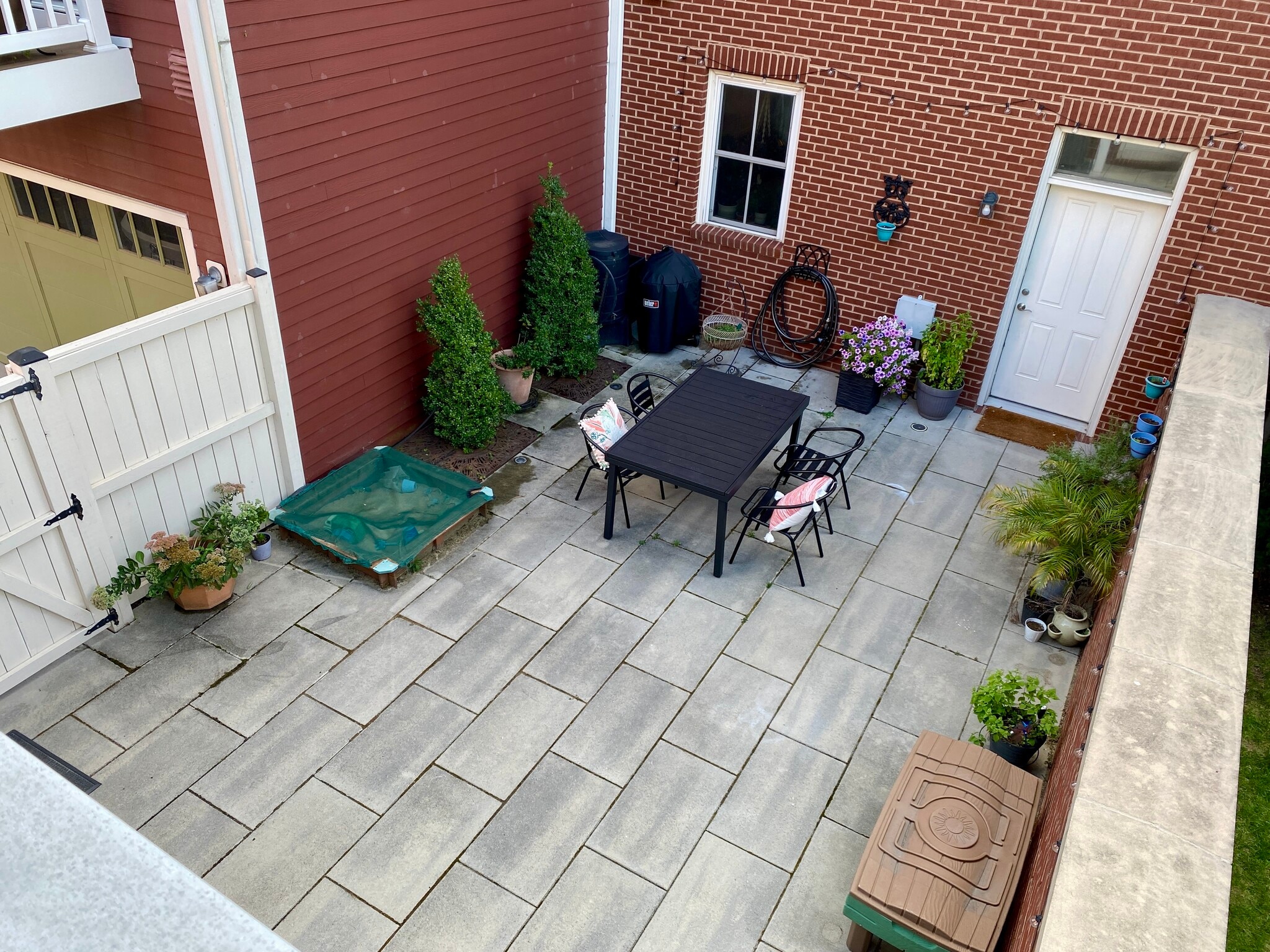 View from balcony down to shared patio. - 2115 Main Line Blvd