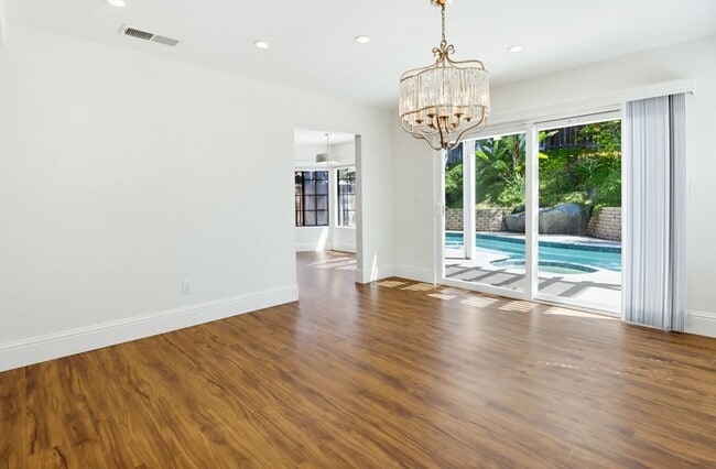 Building Photo - Stunning Upgraded 4BR Home with Pool in Desirable Rancho San Diego – Move-In Ready