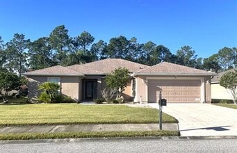 Building Photo - Luxurious Palm Coast Retreat: 4-Bed 3 Bath...