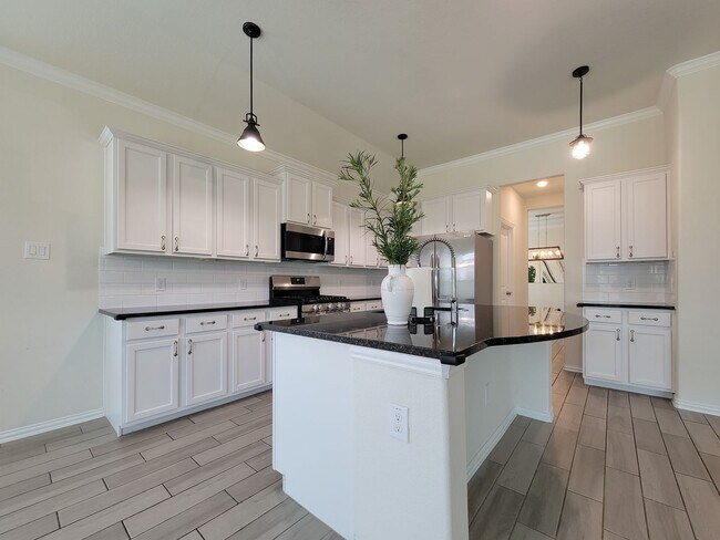 Building Photo - This thoughtfully designed home boasts 4 spacious bedrooms (2 down) and 3.5 baths, providing ampl...