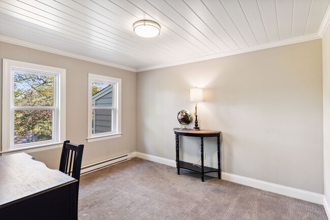 Main level room makes for a great TV room or designated home office space - 207 Benton Ave