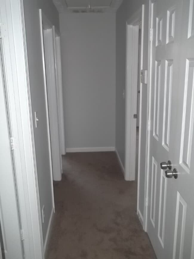 Building Photo - Freshly painted and new flooring in this 4 Bedroom 2 and Half Bath home. Covered front porch with...