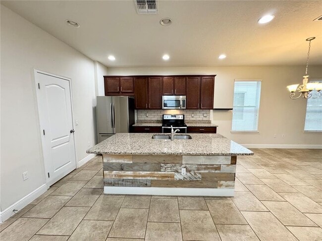 Building Photo - 7208 Milestone Dr
