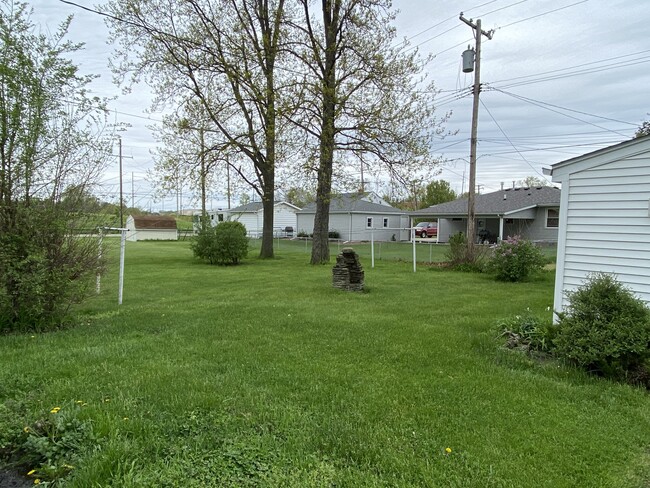 West side of yard (with clothesline) - 128 Standish Dr