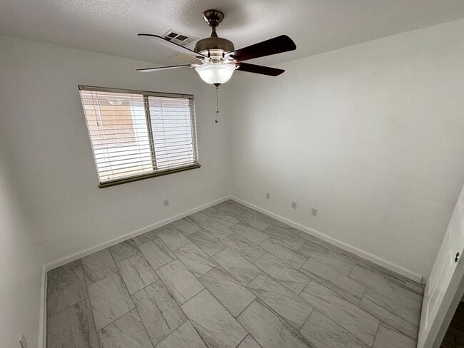 Building Photo - This inviting single-story home boasts a s...