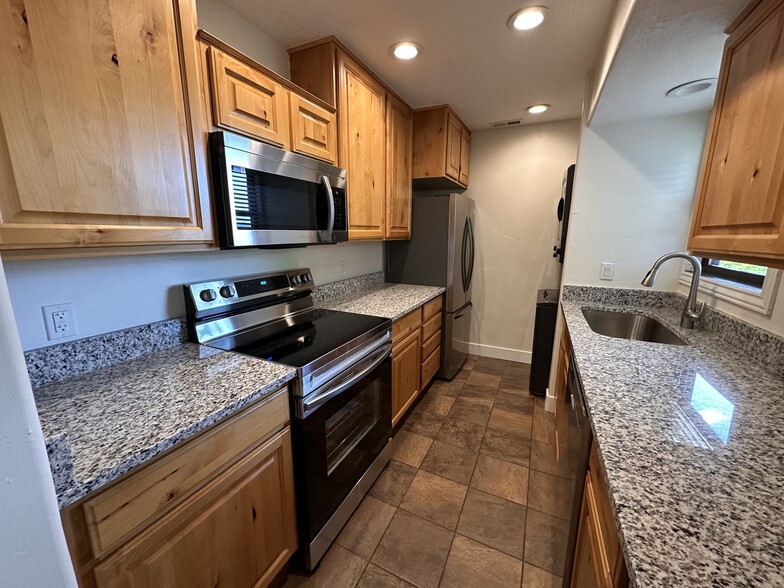 Kitchen with new appliances and washer dryer. - 7035 N 2200 W