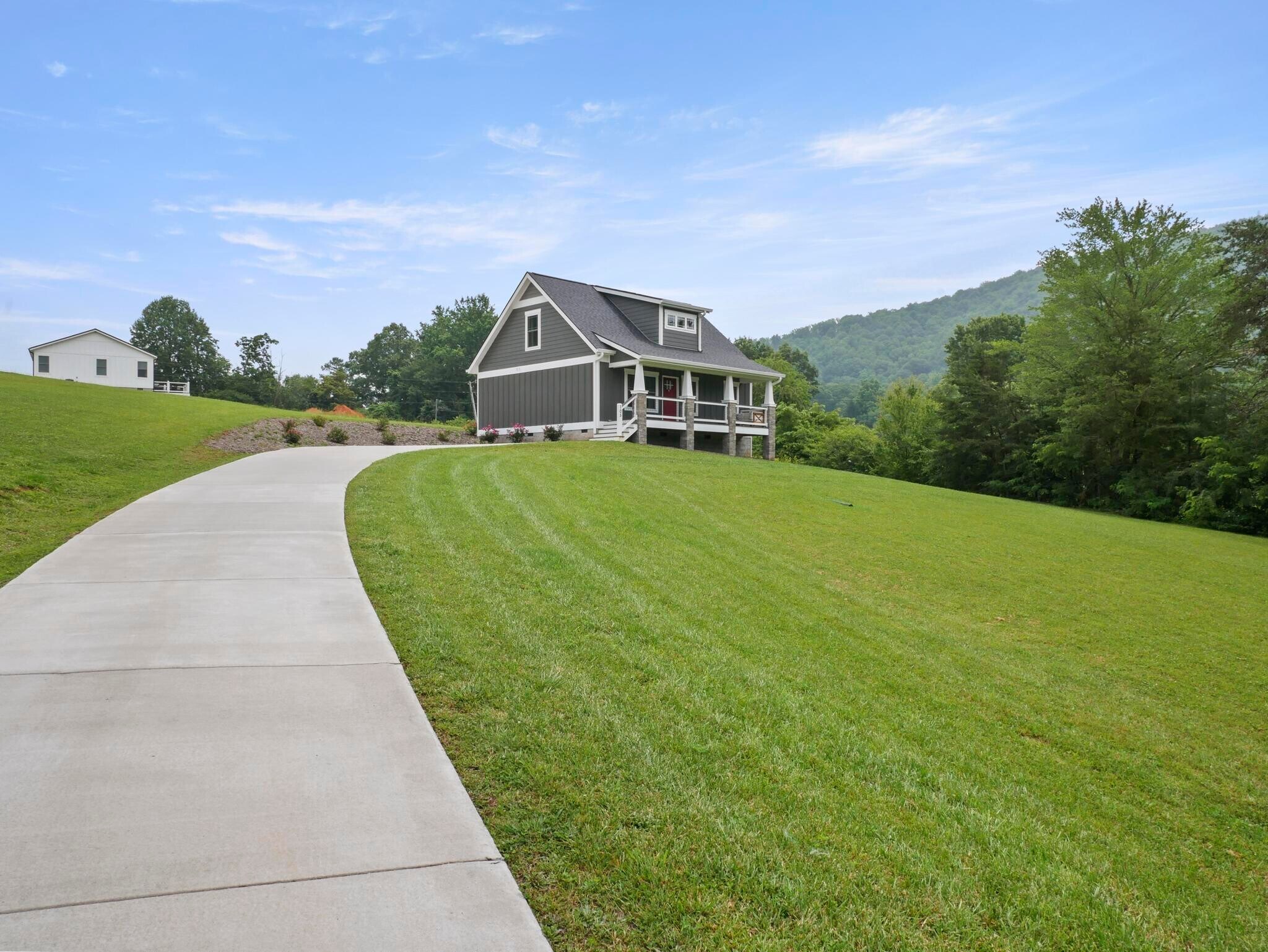 Large concrete driveway leading to the house - 105 Bobby Ridge Dr