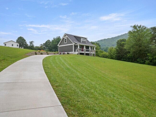 Large concrete driveway leading to the house - 105 Bobby Ridge Dr