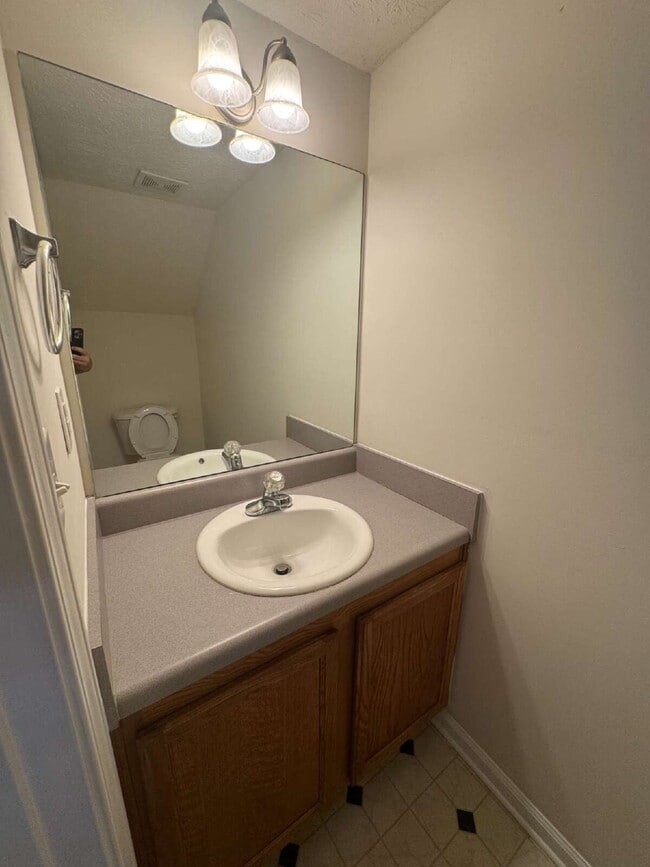 Building Photo - Built in 2004, this two-story townhouse in the Wellington Walk community offers 1,205 square feet...