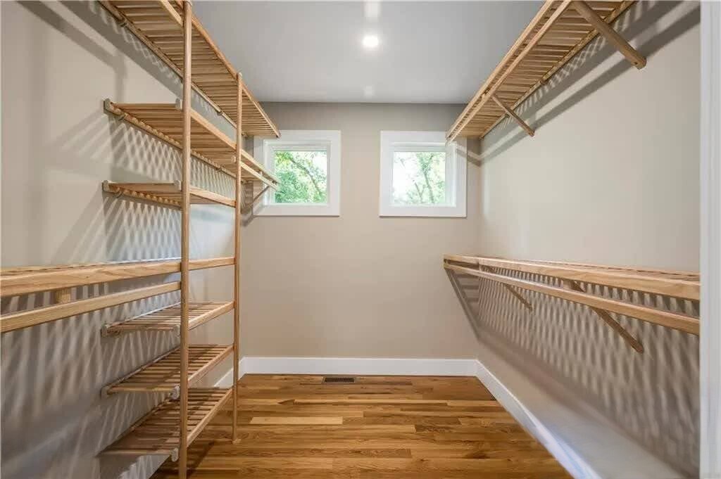 Huge primary bedroom walk-in closer with windows. - 33 Rex Dr