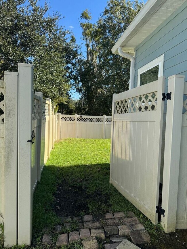 Building Photo - COMING SOON! Beautiful 4BR 3BA Home w/ Screened Lanai & Pond View • Garage Parking • Fenced Yard ...