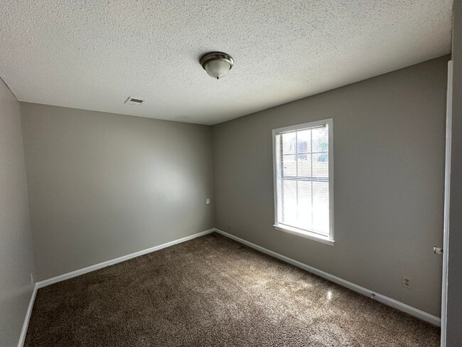 Building Photo - Grand 4BR/2BA Near Southwind | 2,438 Sq Ft, Stone Fireplace, Soaking Tub & 2-Car Garage