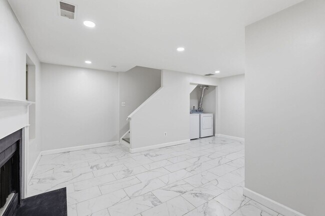 Building Photo - Experience contemporary living in this beautifully renovated residence where modern design meets ...