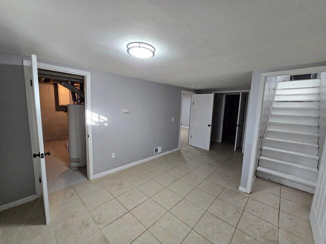 Building Photo - 3 bedroom with bonus extra room in basement fully rehabed