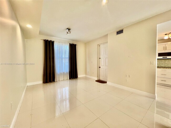 Building Photo - 3 br, 2.5 bath Condo - 8625 SW 152nd Ave A...