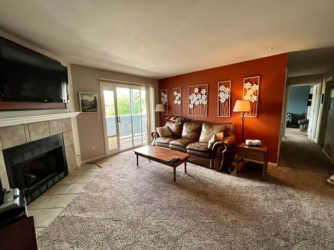 Living room with gas fireplace - 4670 White Rock Cir