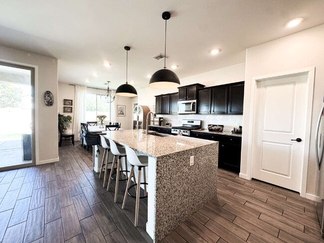 Building Photo - "Spacious 4-Bedroom, 2.5-Bathroom SOLAR Home in Mesa del Sol!"