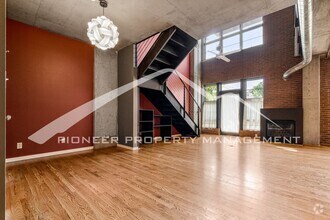 Building Photo - Modern Industrial Condo Downtown with Park...
