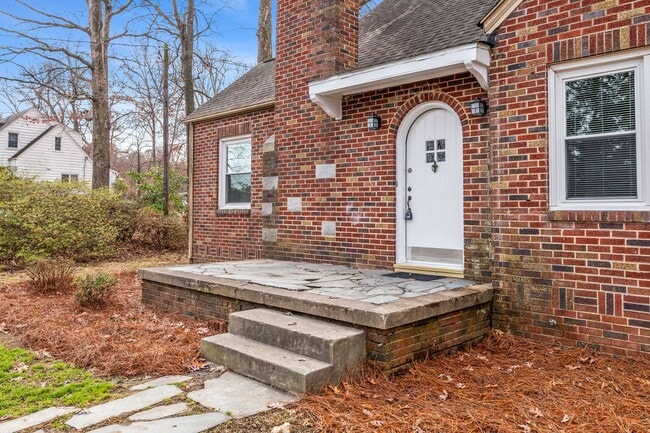 Building Photo - SW, Large Brick Two Bedroom PLUS Two Sun-Rooms, Hardwoods, LR & Separate DR, Fire Place!