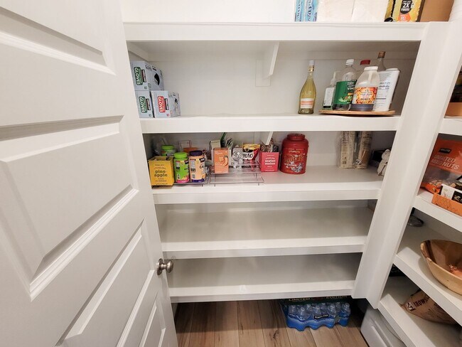 Building Photo - A true gem on a quiet corner lot, this spacious and sun-filled home is tucked away from street no...