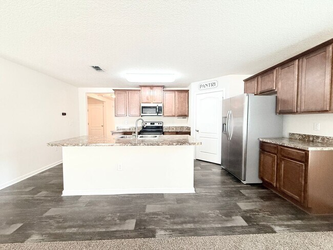 Building Photo - Spacious 4BR Home with Large Fenced Yard & Community Pool