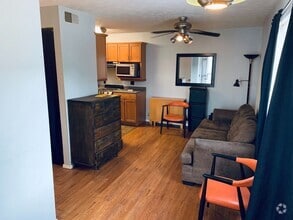 Building Photo - Village Green Condos C-202