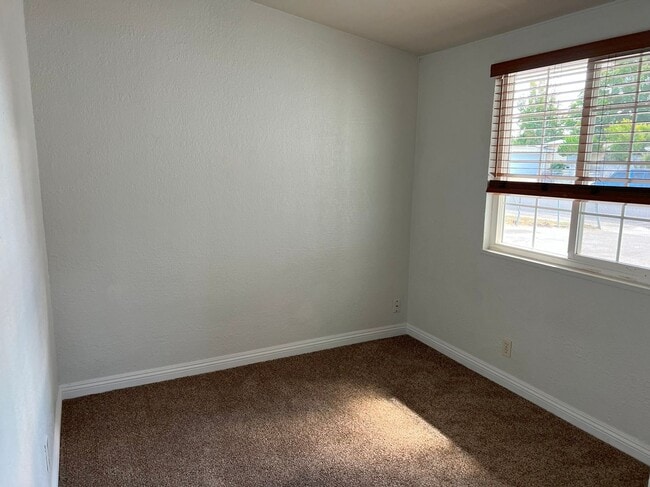 Building Photo - UPDATED BRIGHT OPEN LAYOUT LARGE BACK YARD...