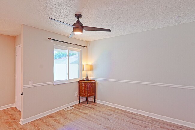 Building Photo - Spacious 3-Bedroom Condo with Finished Basement & Private Fenced Yard!