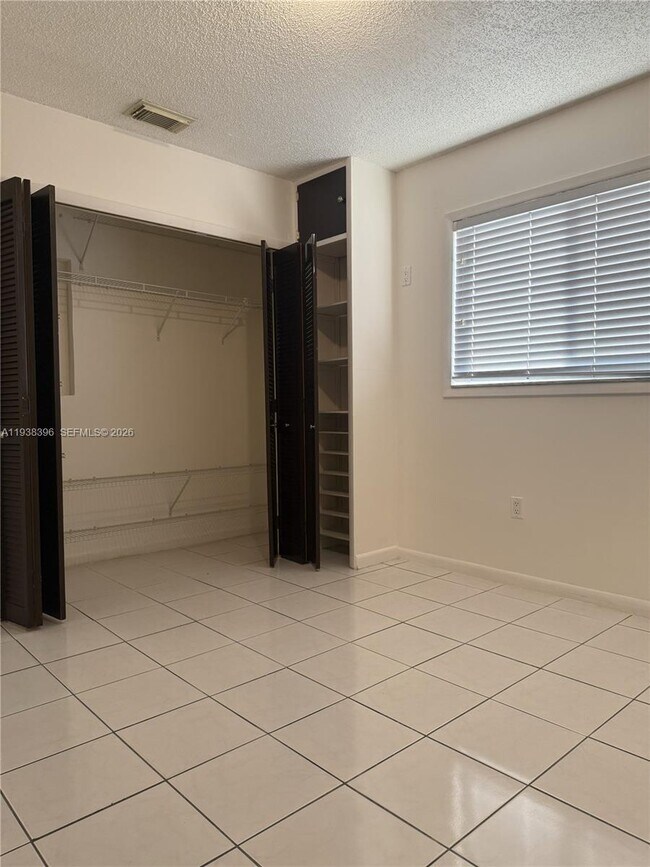 Building Photo - 10101 W Okeechobee Rd