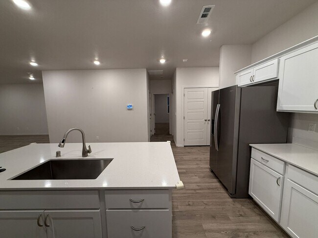 Building Photo - New Construction 4 Bed Mead School District Rancher w/ Fully-Fenced Yard and Attached Garage!