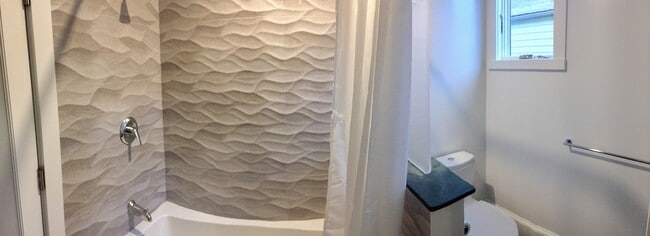 Porcelain tiles in bathroom provide style and superior function & hygiene - 3918 Webster St