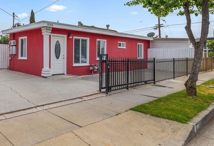 Ext. Front house and parking area - 1048 S Record Ave