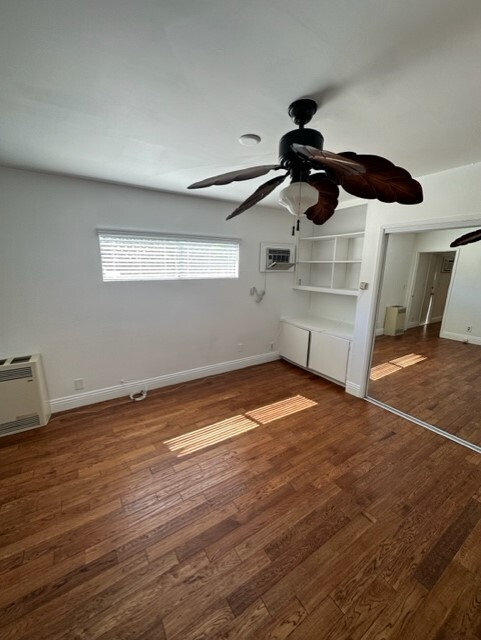 Same large bedroom with extra cabinets and book book shelves. - 5545 1/2 Allott Ave