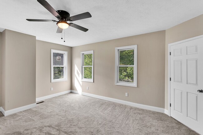 Primary bedroom full of sunshine - 2416 Magee Road Ext