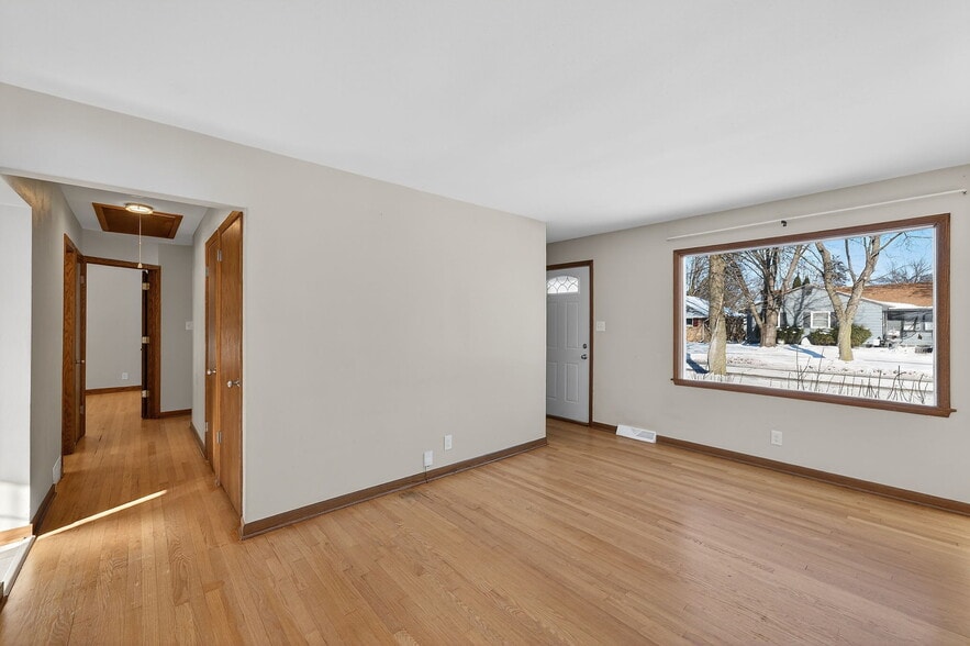 Front door opens to living room with closet across from door for storage - 10525 W Custer Ave