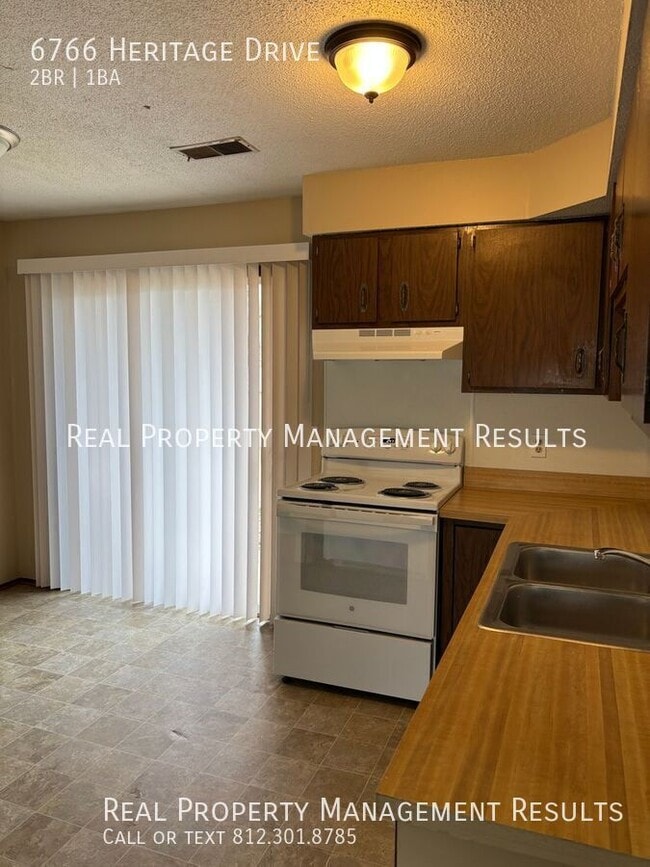 Building Photo - 6766 Heritage Dr