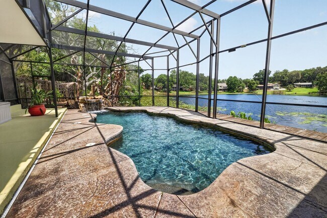 Building Photo - Available Now! Waterfront Living at Its Best – Pool, Decks & Gated Privacy