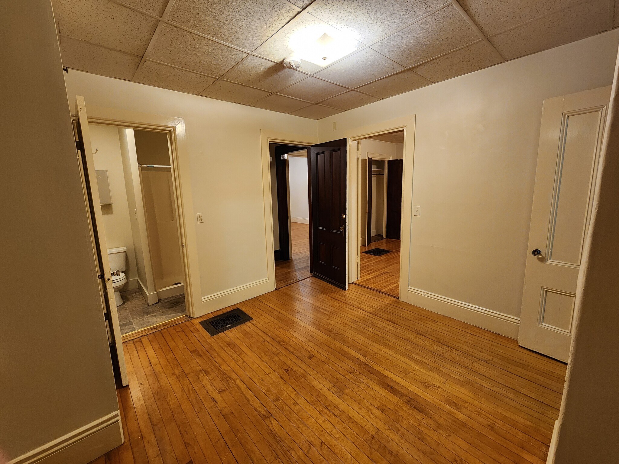 Another angle of middle room, at night - 46 Saunders St