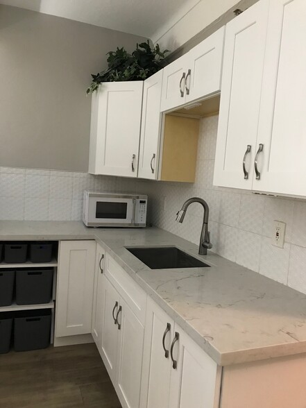 Kitchentte includes microwave, small shelves with bins for storage such as a pantry - 7350 N Pima Rd