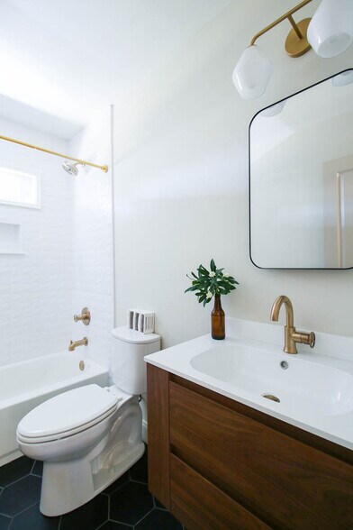 Modern bathroom with 3-D tile surrounded tub. - 2406 Boswell Rd