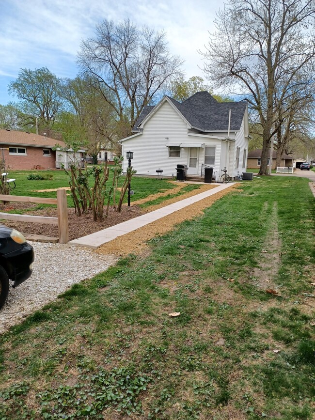 rear parking, sidewalk to house - 203 S Harrison St