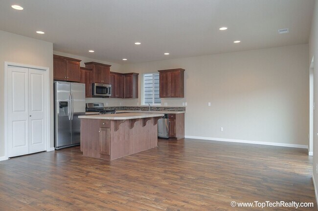 Building Photo - Spacious 4-Bedroom + Office Home in Abbey Creek – Modern Finishes, EV Charger & Low-Maintenance B...