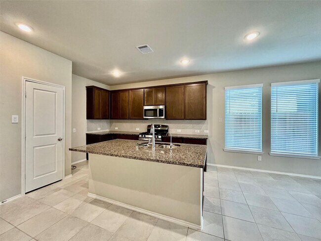 Building Photo - 8711 Windsong Trail Dr
