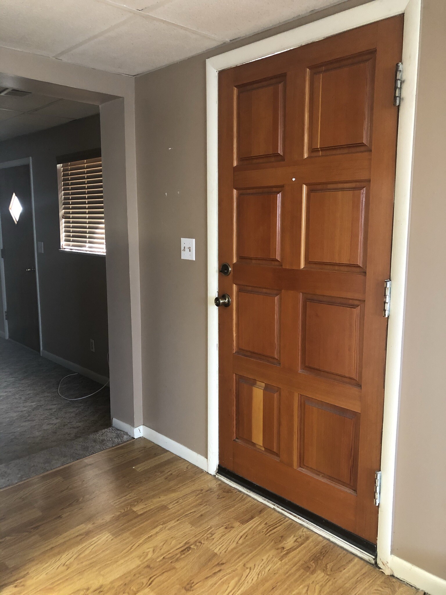 Front door leading to kitchen and dining area. To the left is separate living room. - 3713 S Maple Ln