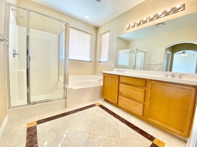 Building Photo - THIS SPACIOUS RESIDENCE FEATURES 4 BEDROOM...