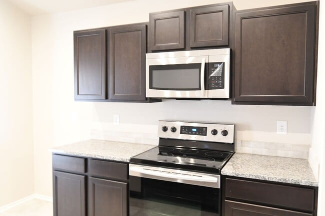 Building Photo - Beautiful Brand New Custom Brick Home 3 bed/ 2 bath/ 2 car garage Open Concept with huge backyard...